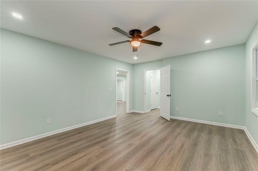 43 King Bee Circle Rome, GA 30161 - Photo 26 of 47 an empty room with wooden floor and windows