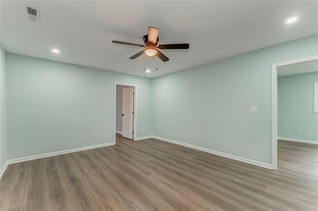 43 King Bee Circle Rome, GA 30161 - Photo 27 of 47 wooden floor in an empty room with a window