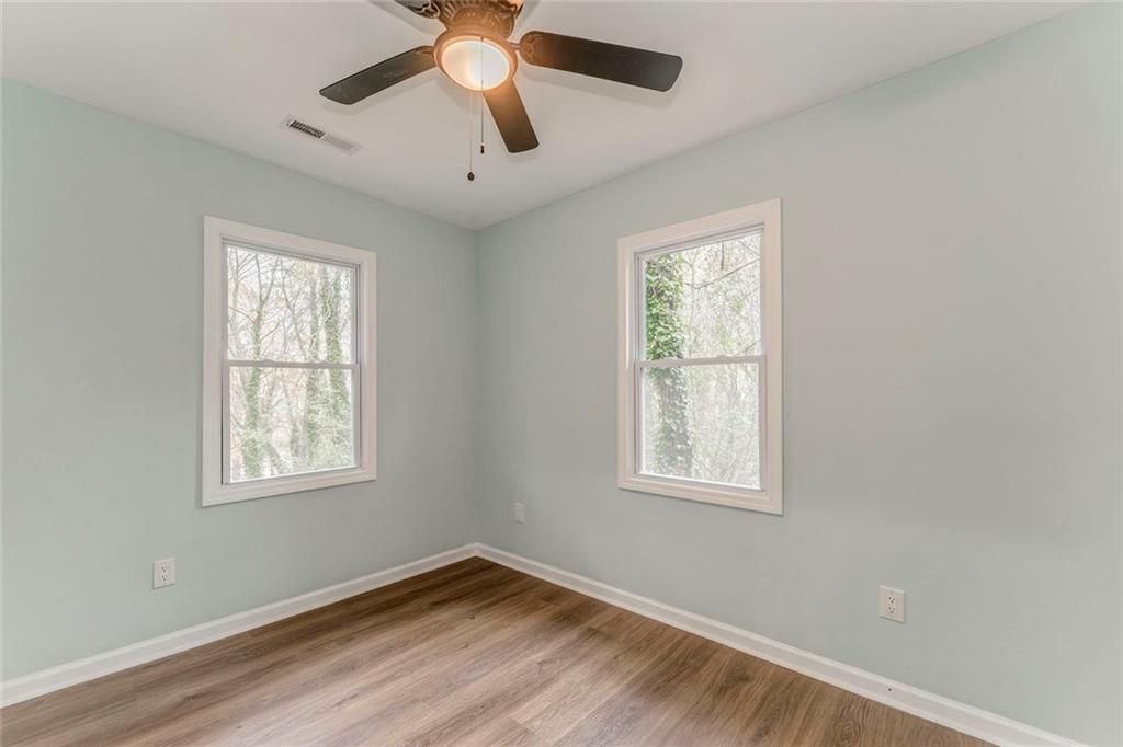 43 King Bee Circle Rome, GA 30161 - Photo 28 of 47 a view of a big room with wooden floor and windows