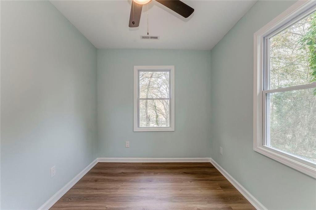 43 King Bee Circle Rome, GA 30161 - Photo 29 of 47 a view of an empty room with wooden floor and a window
