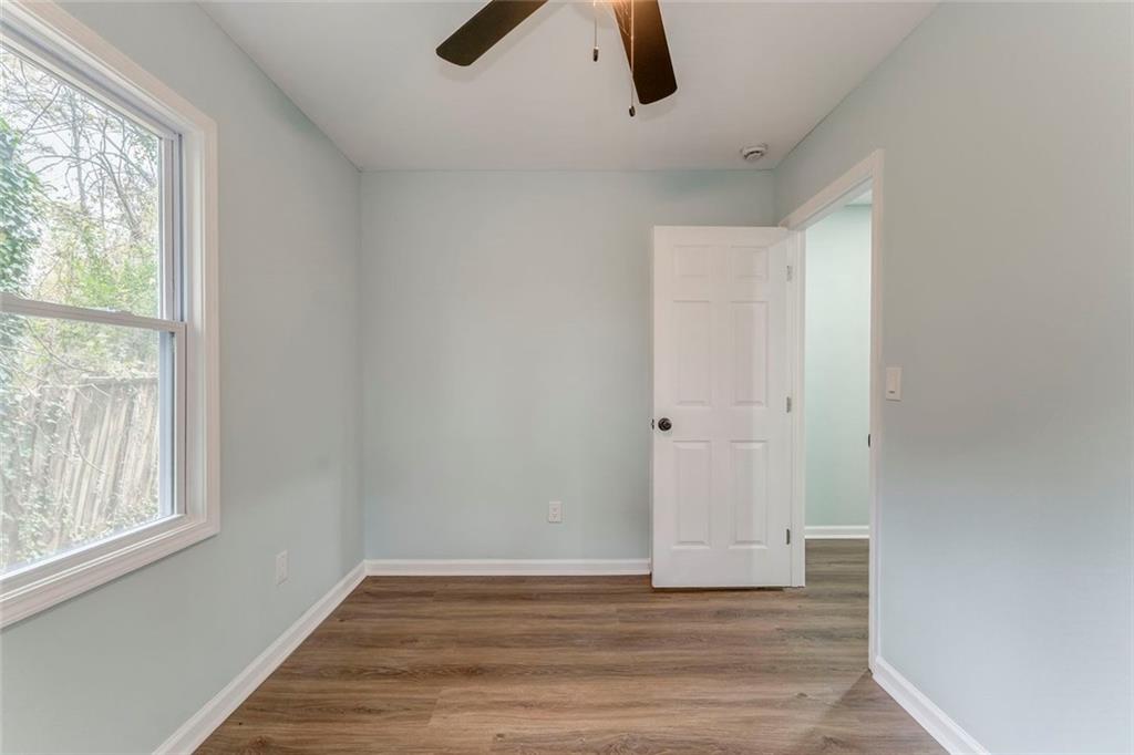 43 King Bee Circle Rome, GA 30161 - Photo 31 of 47 a view of an empty room with wooden floor and window