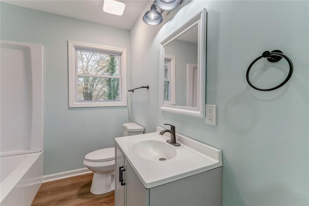 43 King Bee Circle Rome, GA 30161 - Photo 33 of 47 a bathroom with a toilet a sink and mirror