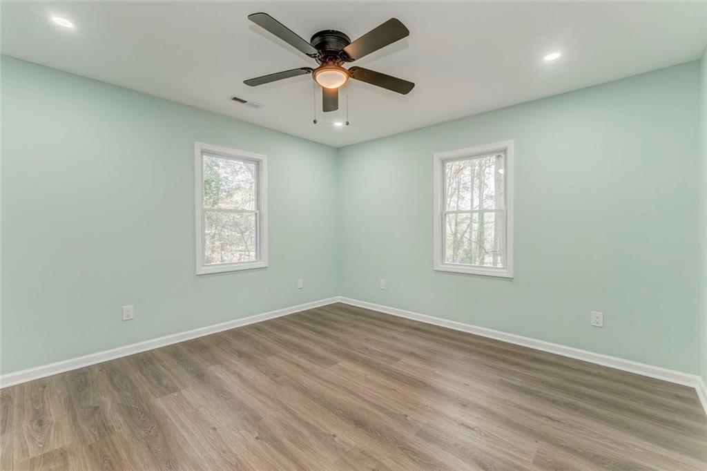 43 King Bee Circle Rome, GA 30161 - Photo 34 of 47 an empty room with windows and fan