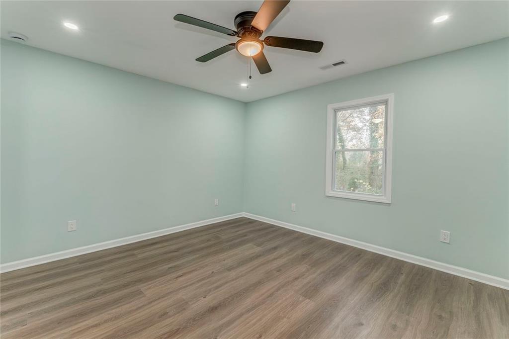 43 King Bee Circle Rome, GA 30161 - Photo 36 of 47 an empty room with a window and a fan