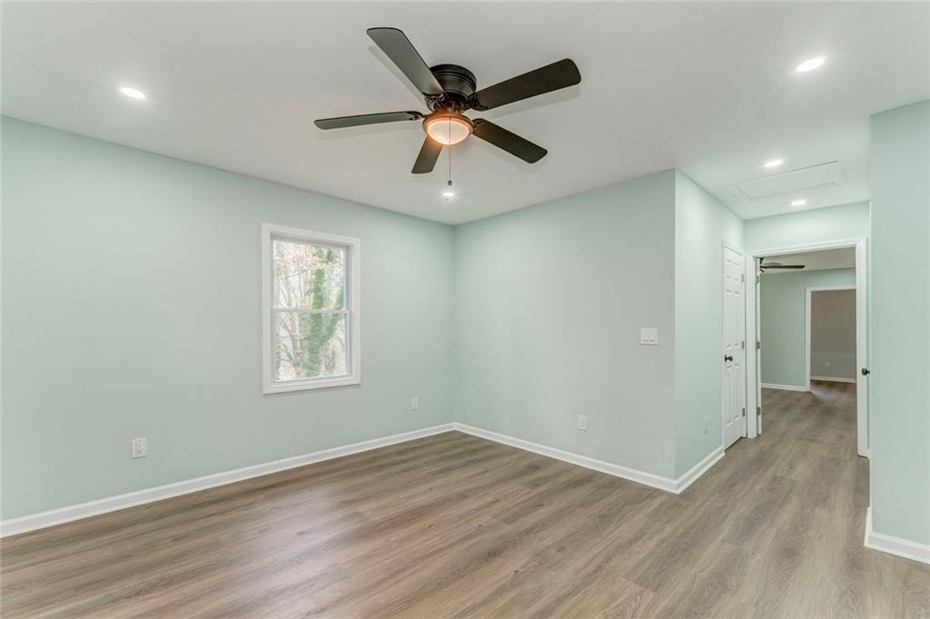 43 King Bee Circle Rome, GA 30161 - Photo 38 of 47 a view of an empty room with wooden floor and a ceiling fan