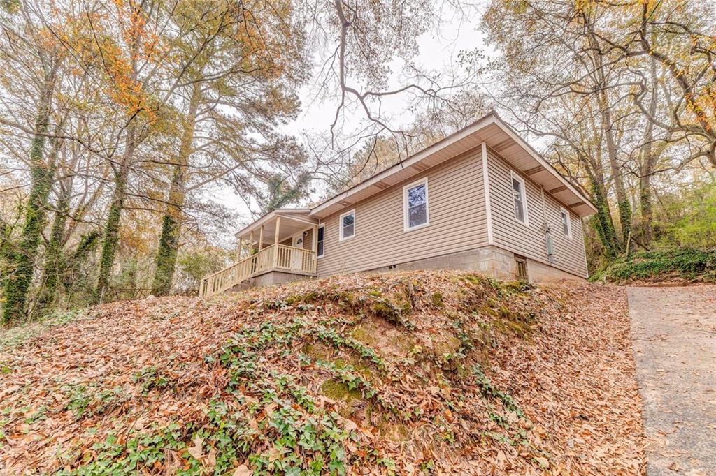 43 King Bee Circle Rome, GA 30161 - Photo 4 of 47 a backyard of a house with large trees