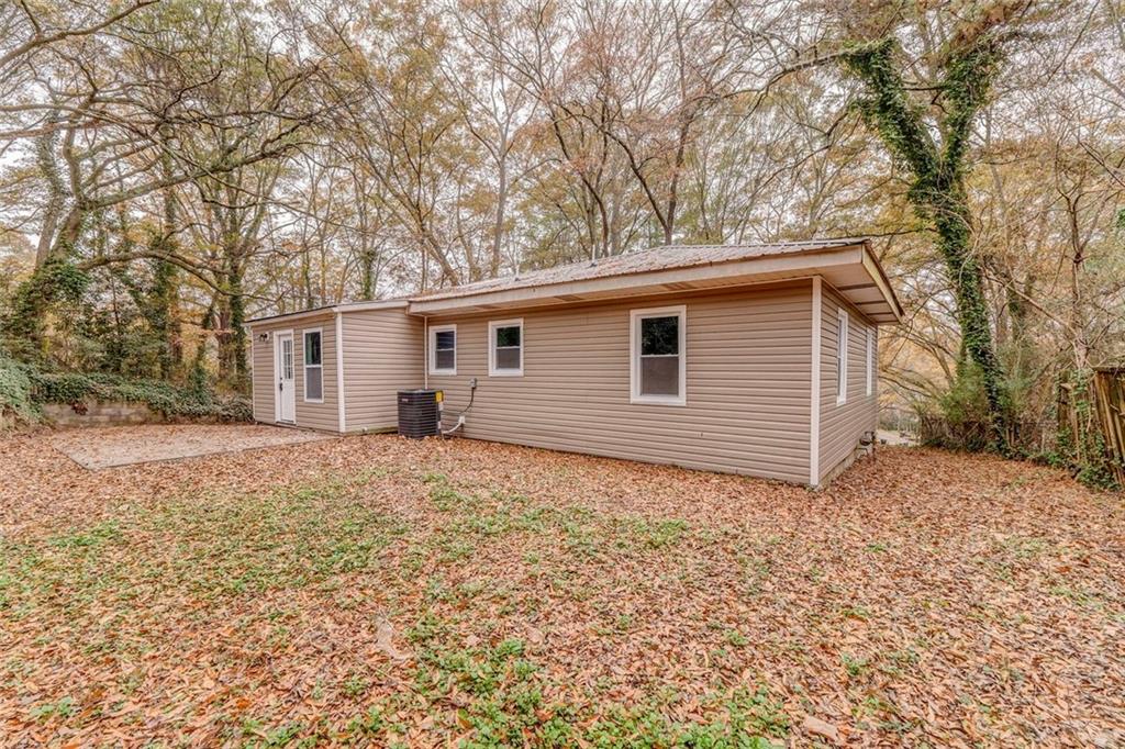 43 King Bee Circle Rome, GA 30161 - Photo 42 of 47 a backyard of a house with large trees