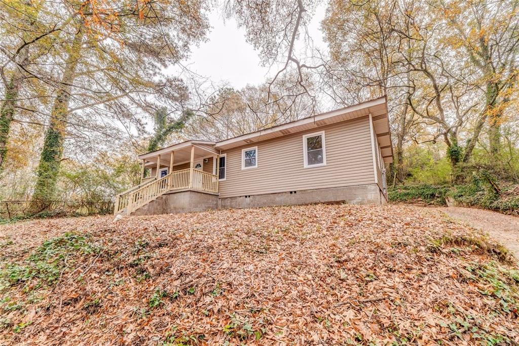 43 King Bee Circle Rome, GA 30161 - Photo 5 of 47 a backyard of a house with large trees