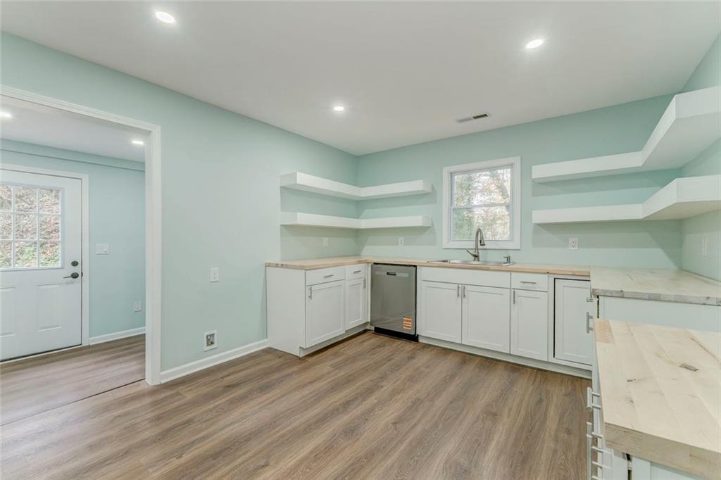 43 King Bee Circle Rome, GA 30161 - Photo 9 of 47 a kitchen with a sink cabinets and wooden floor