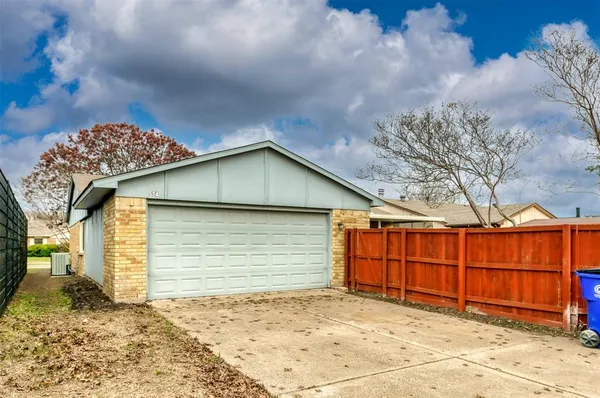 a front view of a house with a garage