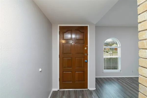 a view of entryway with wooden floor