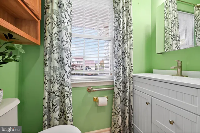 a bathroom with a toilet and a sink