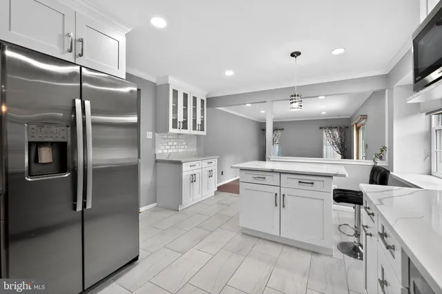a kitchen with cabinets and stainless steel appliances
