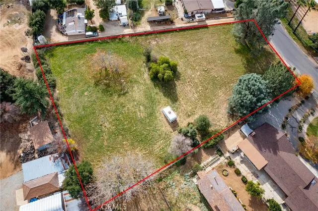 an aerial view of a house with a yard
