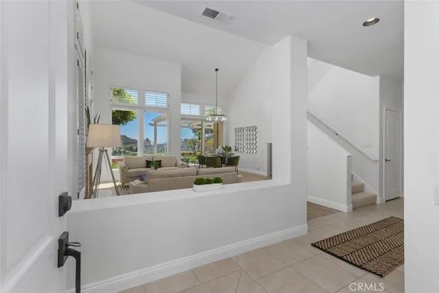 a view of living room with furniture and rug