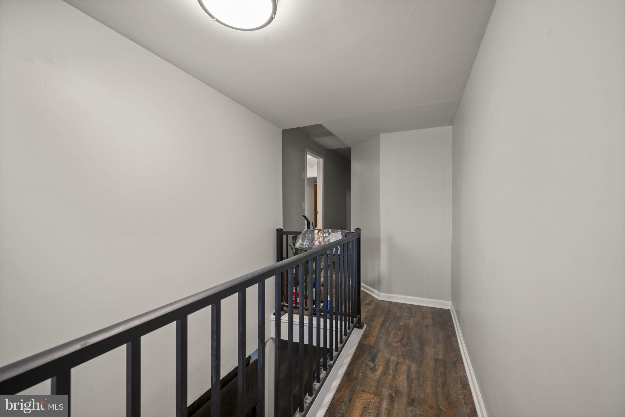 10412 Vincent Road White Marsh, MD 21162 - Photo 20 of 65 a view of a hallway with wooden floor and closet