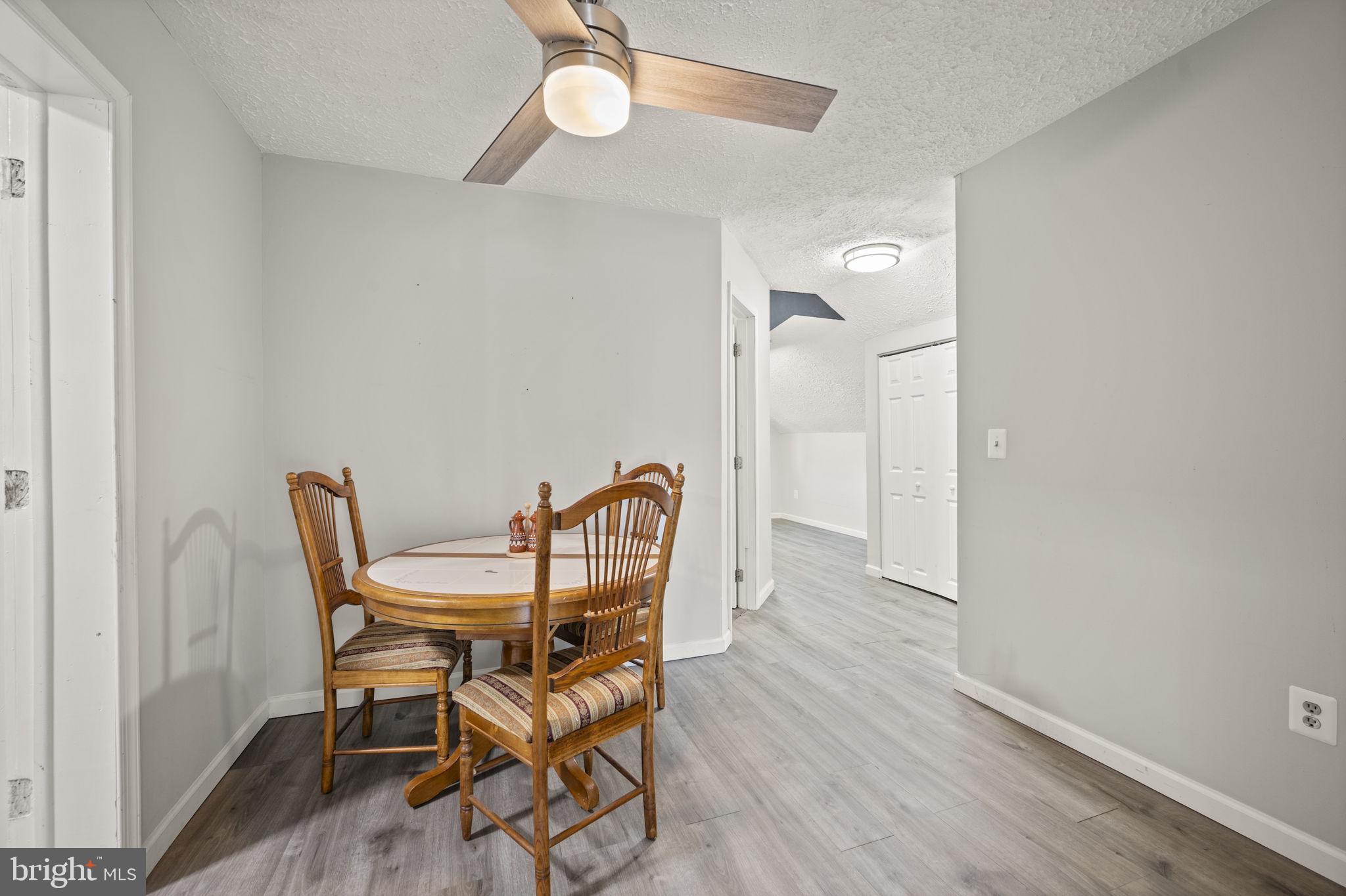 10412 Vincent Road White Marsh, MD 21162 - Photo 39 of 65 a view of a dining room with furniture and wooden floor