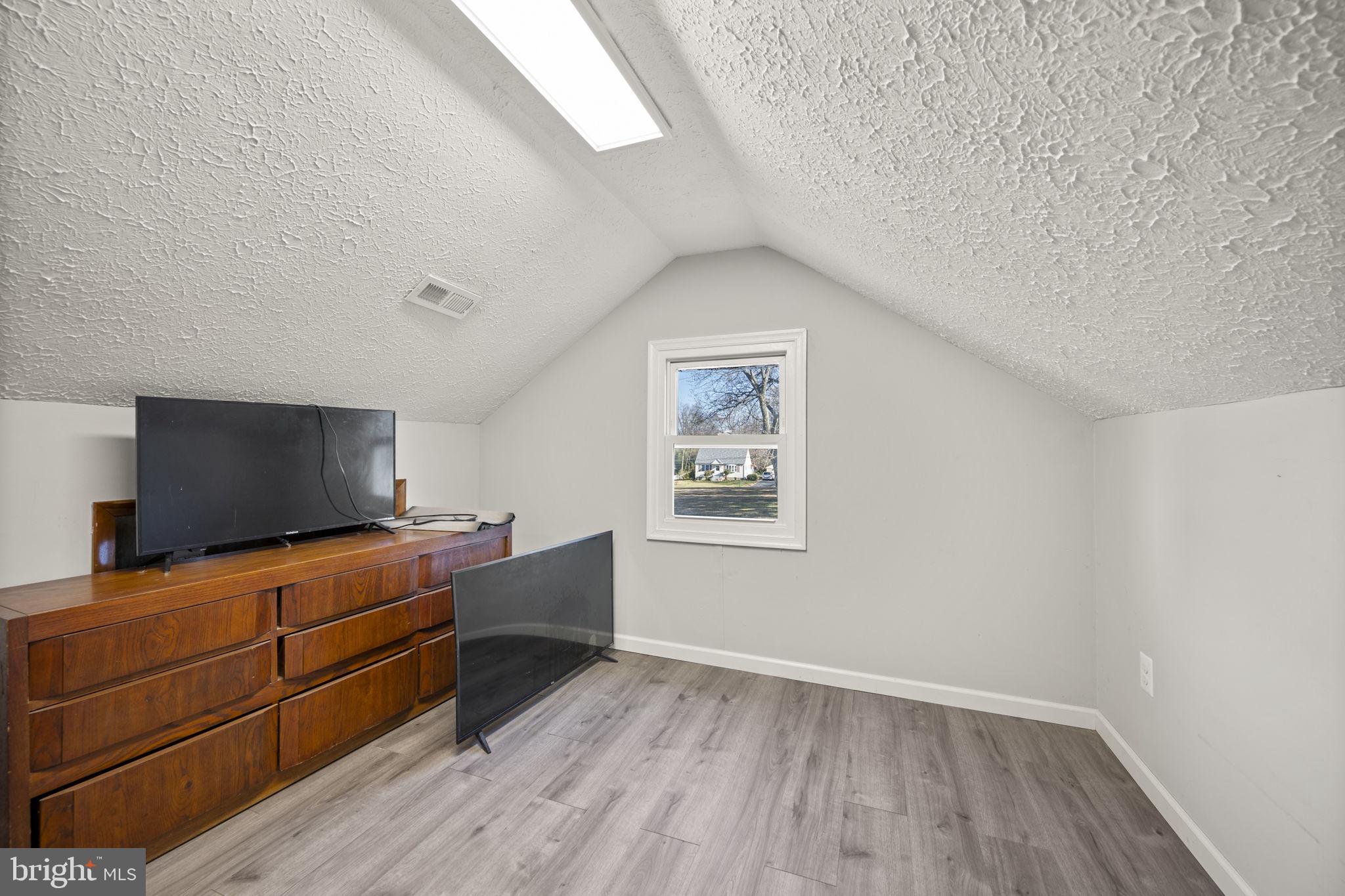 10412 Vincent Road White Marsh, MD 21162 - Photo 40 of 65 a room with furniture and flat screen tv