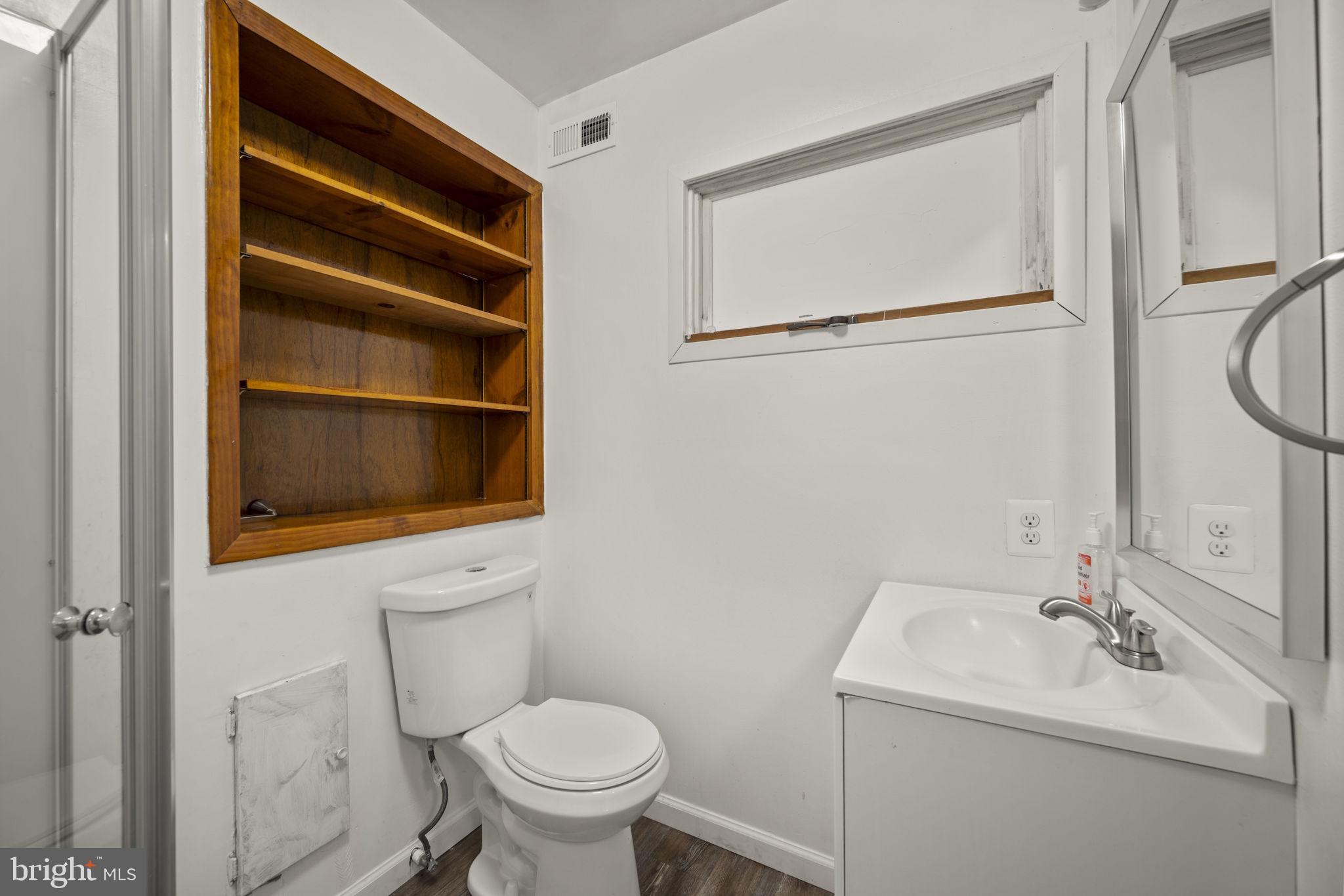 10412 Vincent Road White Marsh, MD 21162 - Photo 46 of 65 a bathroom with a sink a toilet and shower