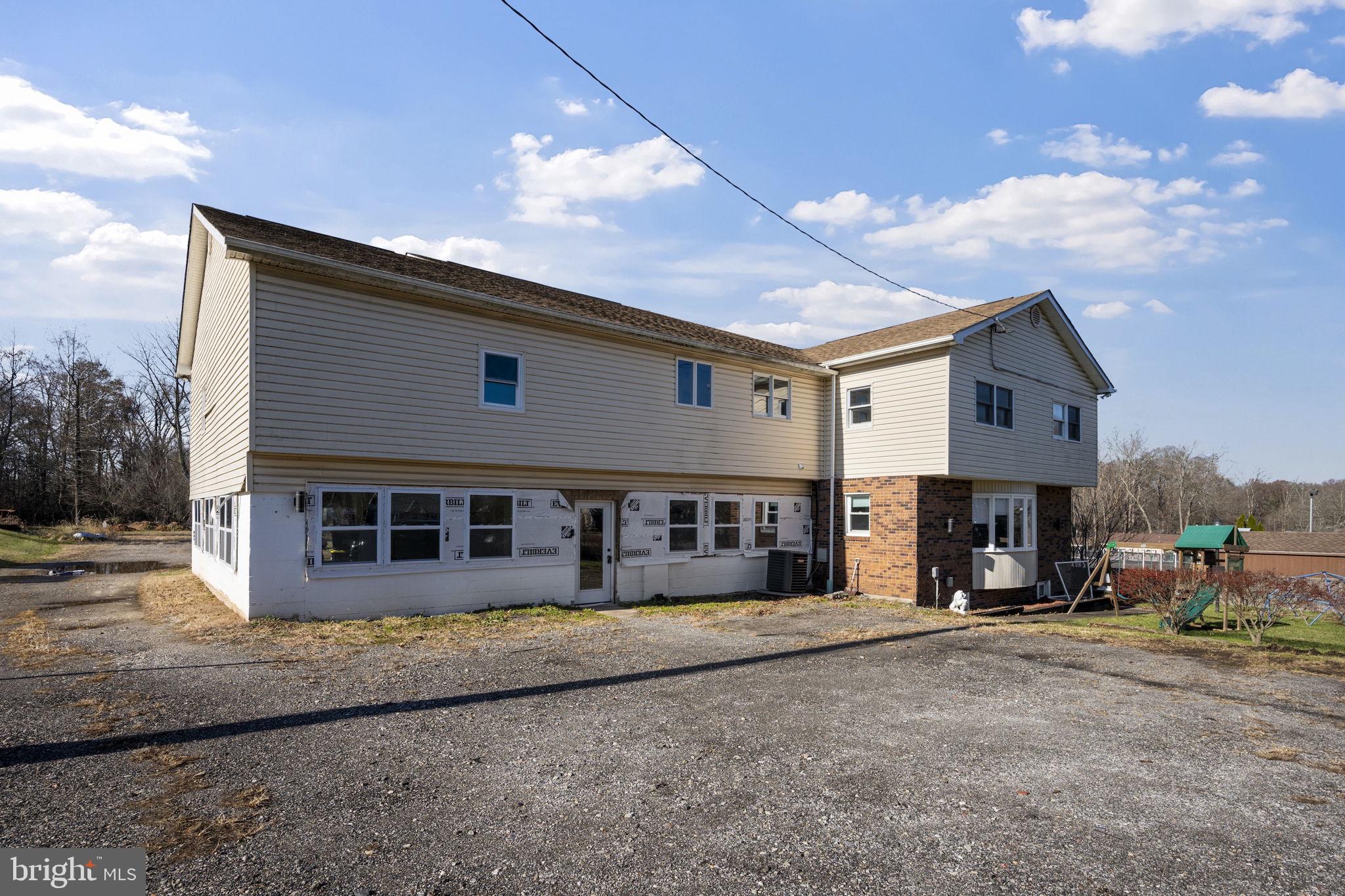 10412 Vincent Road White Marsh, MD 21162 - Photo 5 of 65 a view of a house with a barbeque and large trees