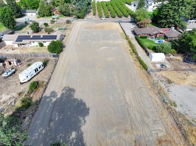 an aerial view of residential house with outdoor space