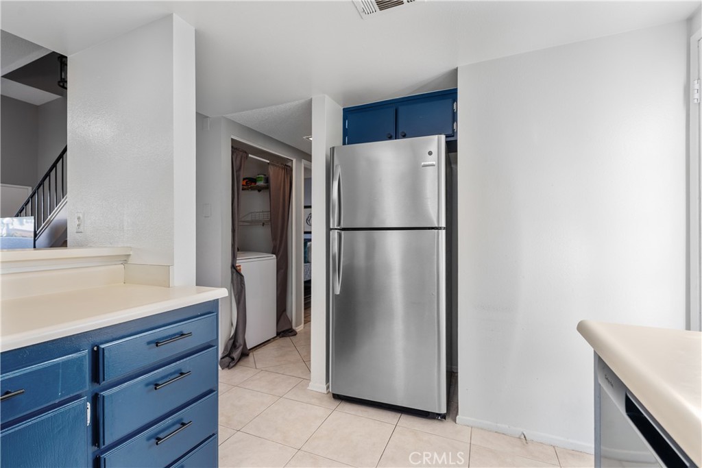 69646 Antonia Way Rancho Mirage, CA 92270 - Photo 28 of 50 a kitchen with a refrigerator and a sink