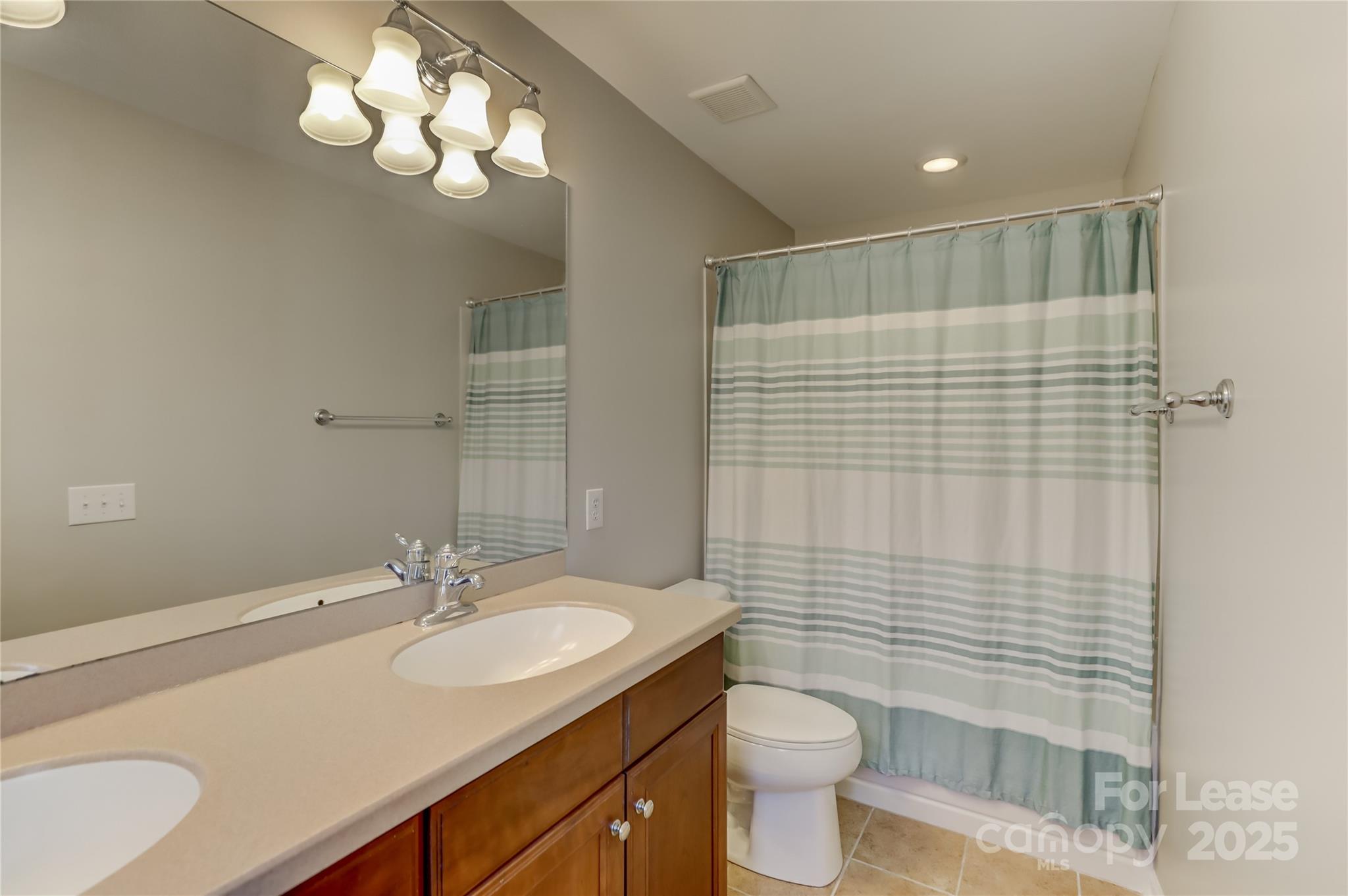 562 6th Baxter Crossing Fort Mill, SC 29708 - Photo 31 of 47 a bathroom with a sink toilet and shower