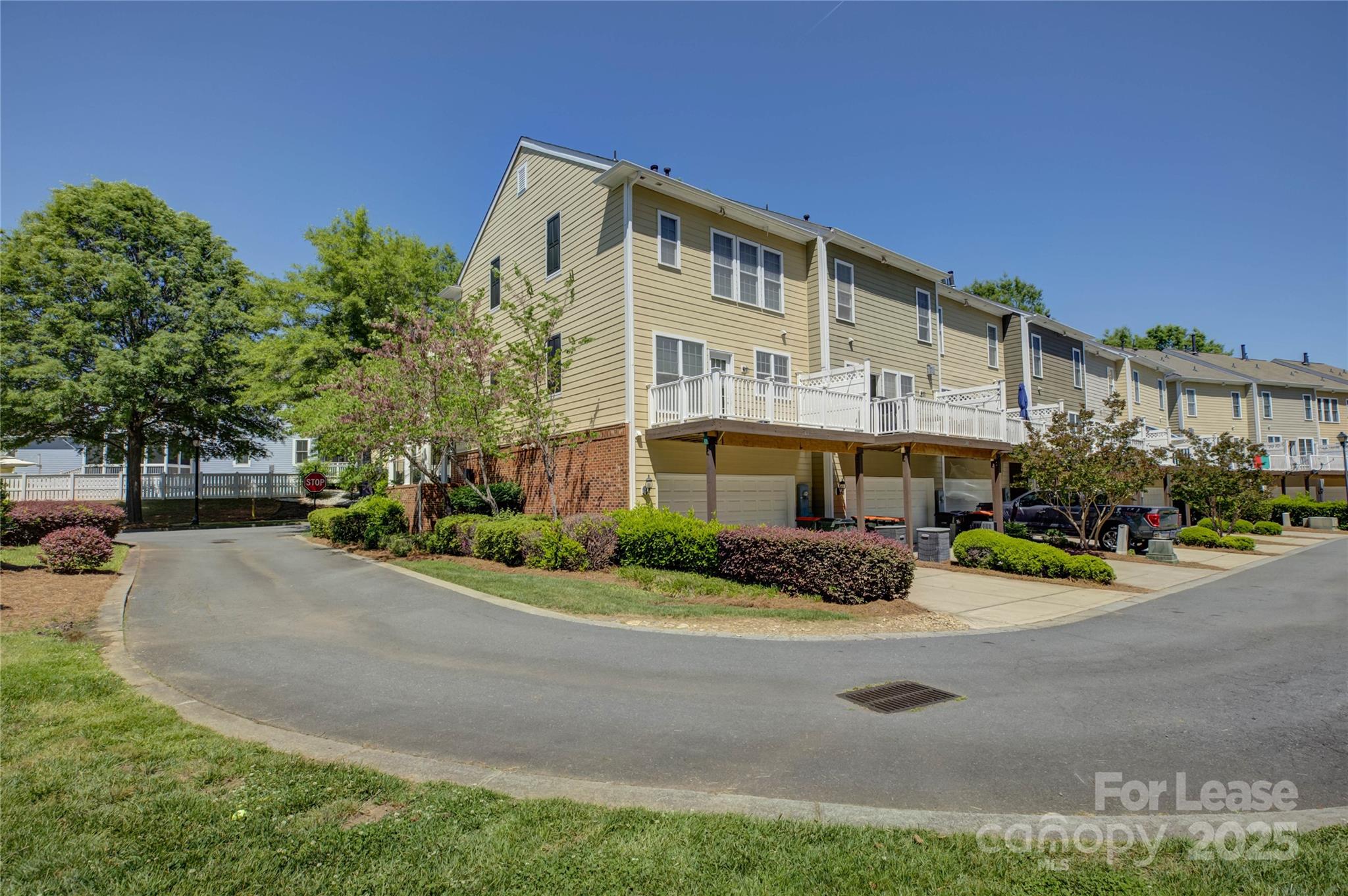 562 6th Baxter Crossing Fort Mill, SC 29708 - Photo 47 of 47 a front view of a building with garden and trees