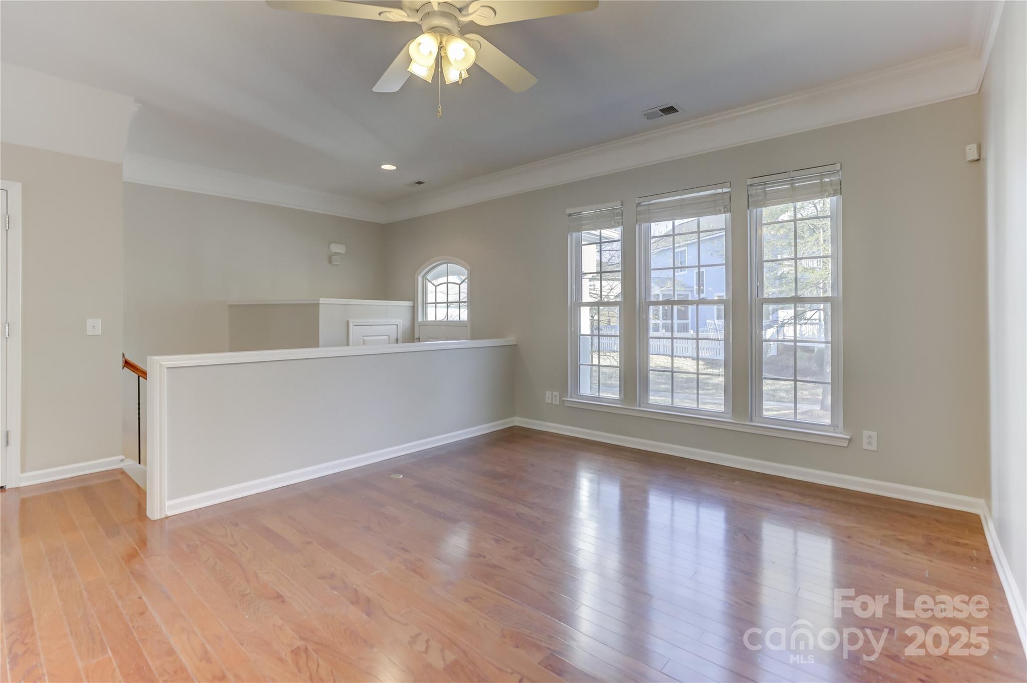562 6th Baxter Crossing Fort Mill, SC 29708 - Photo 10 of 47 a view of an empty room with wooden floor and a window