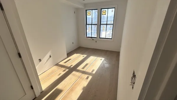 an empty room with windows