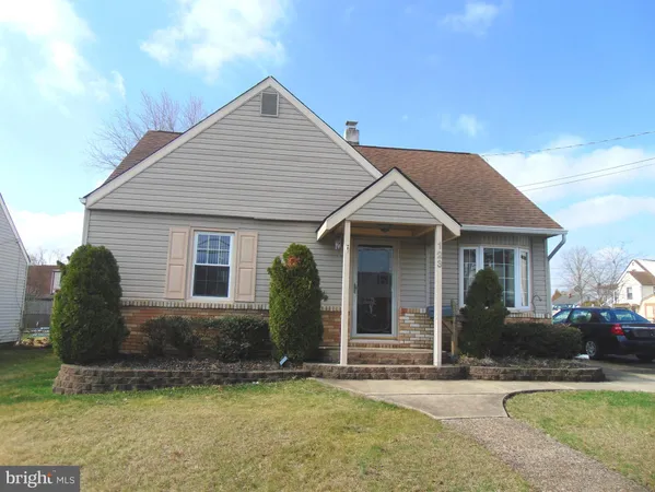 a view of a house with a yard and plants