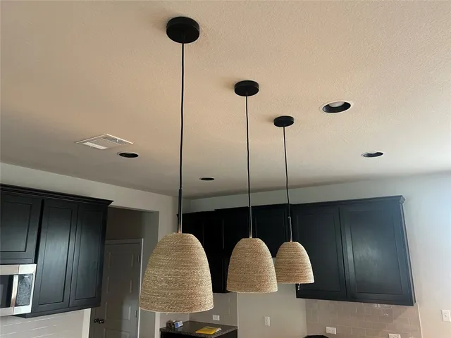 a stove top oven sitting inside of a kitchen