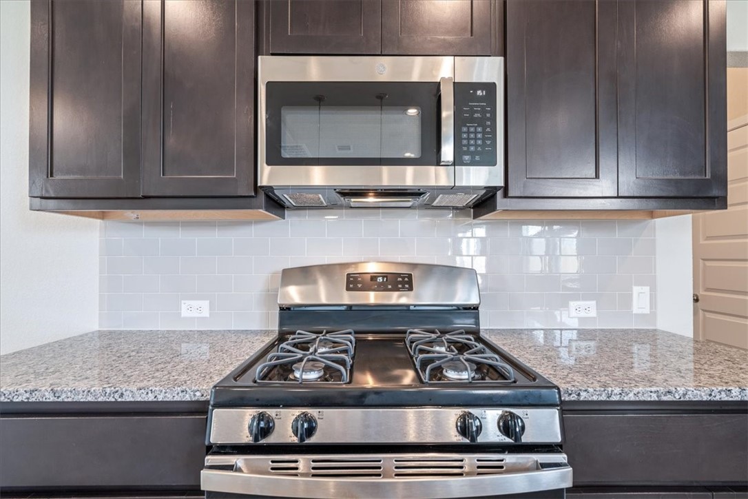 169 Heather Glen Way Maxwell, TX 78656 - Photo 19 of 40 a stove top oven sitting inside of a kitchen