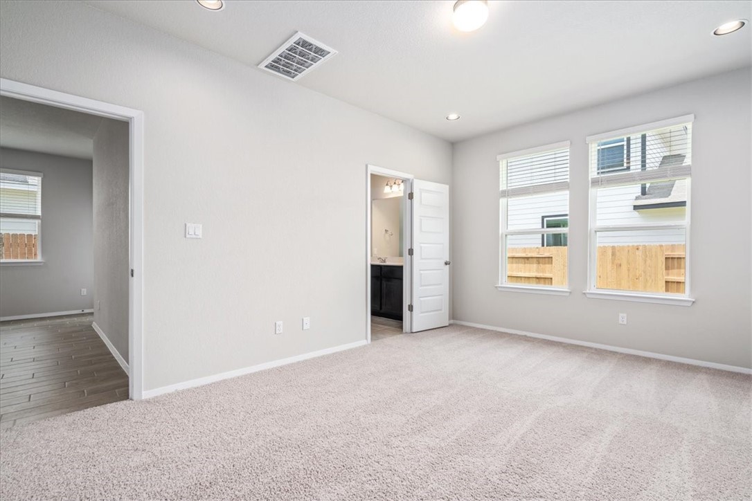 169 Heather Glen Way Maxwell, TX 78656 - Photo 23 of 40 an empty room with windows and closet