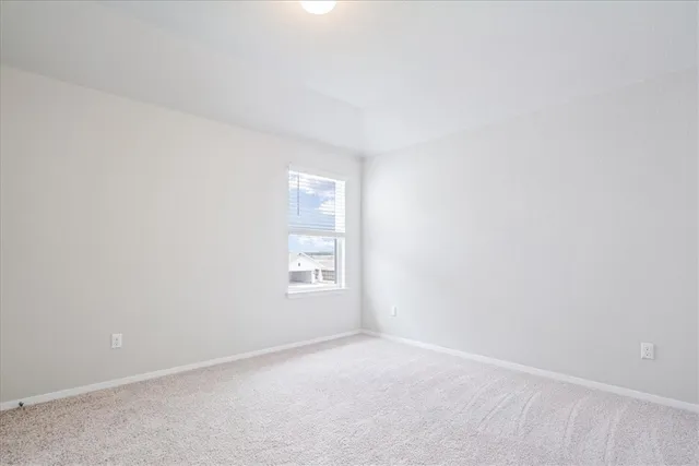 a view of an house with backyard space and garden