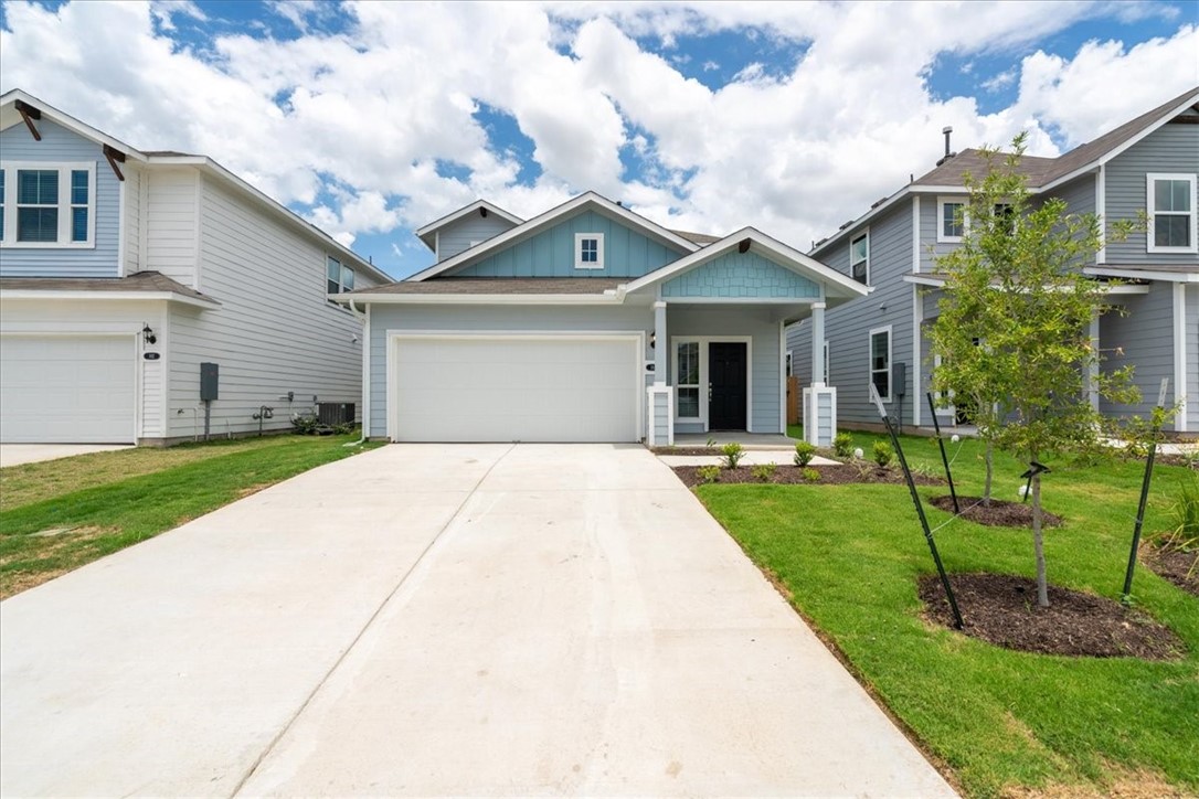 169 Heather Glen Way Maxwell, TX 78656 - Photo 5 of 40 a front view of a house with a yard and garage