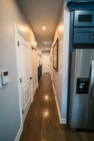 a view of gallery with wooden floor