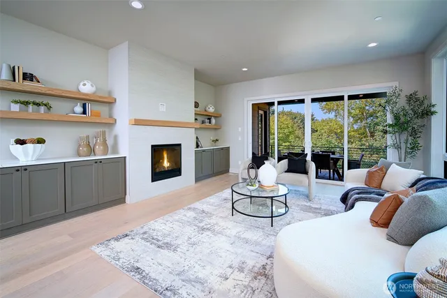 a living room with furniture fireplace and window