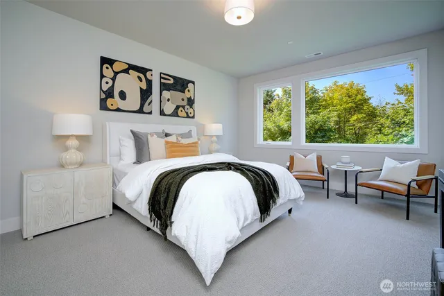 a bedroom with a bed and a couch