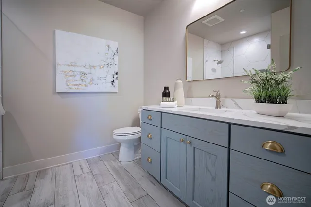 a bathroom with a sink and a toilet