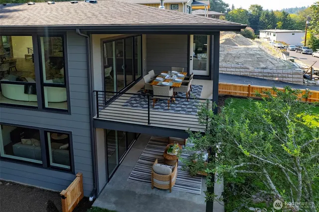a view of a two chair and tables in the balcony