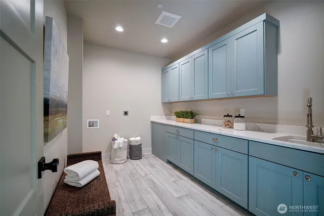 a kitchen with a sink and cabinets