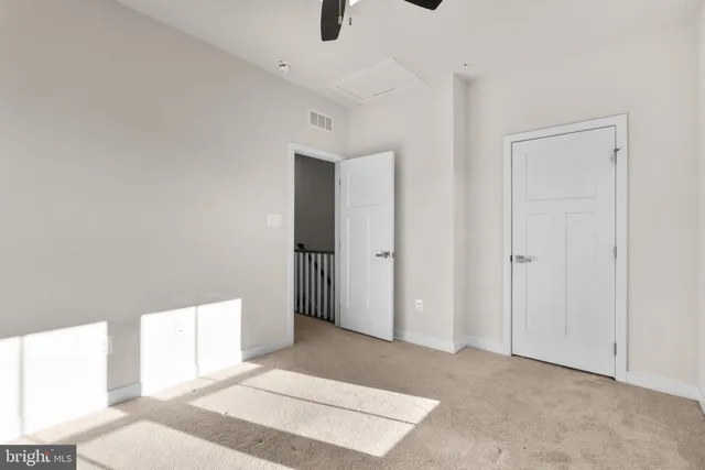 a bathroom with a bathtub shower sink vanity mirror and toilet