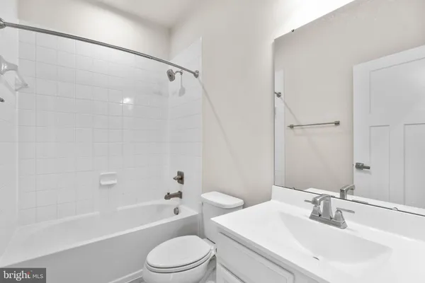 a view of a hallway with a washer and dryer