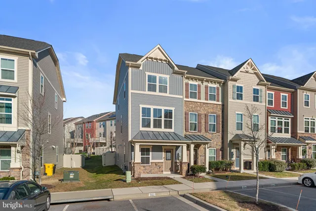 a front view of a residential apartment building with street view