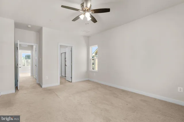 a bathroom with a sink a toilet a mirror and vanity