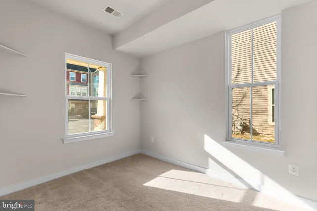 a bathroom with a bathtub shower sink vanity mirror and toilet