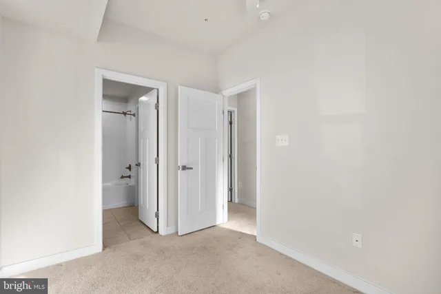 a view of a balcony with wooden floor and fence