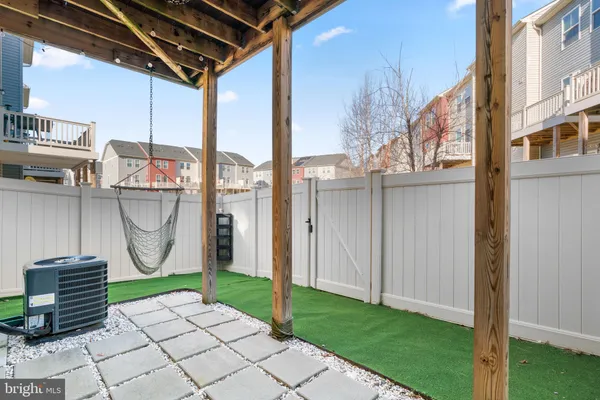 a view of small house with roof deck