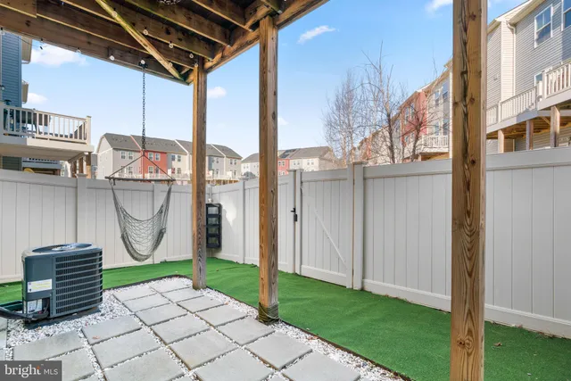 a view of small house with roof deck